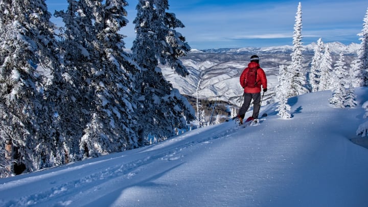 Person skiing in snowy mountains