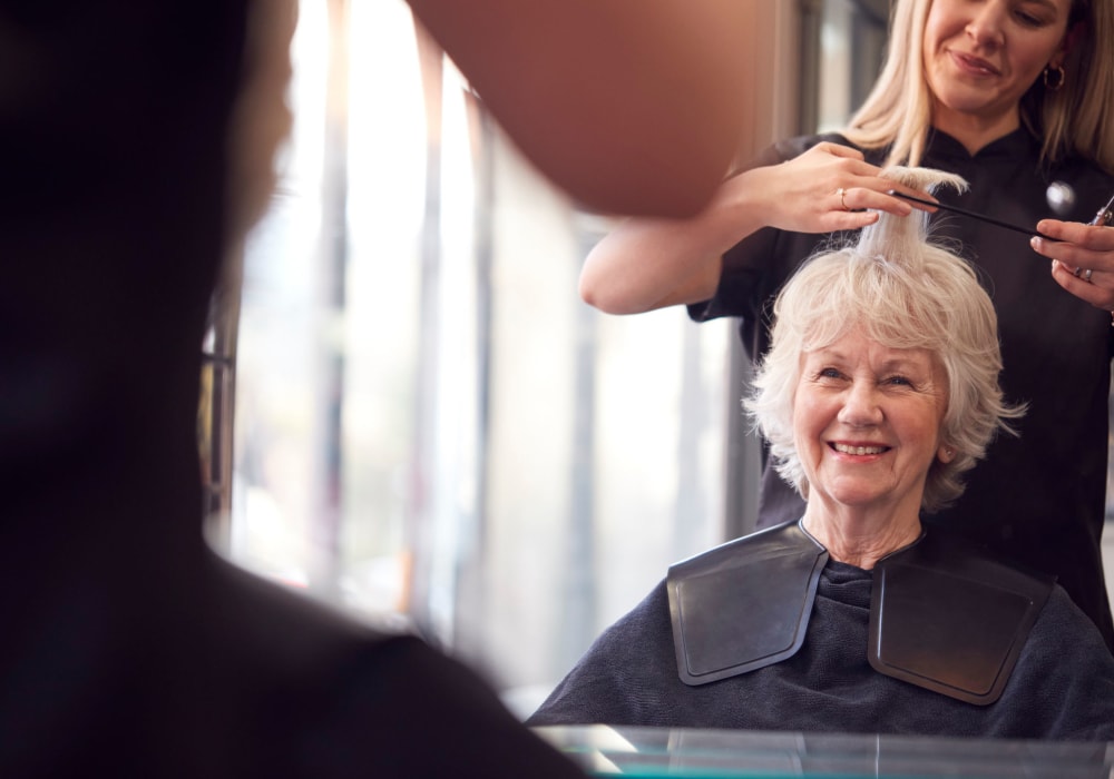 Resident getting a haircut at Holden of Bellevue in Bellevue, Washington. 