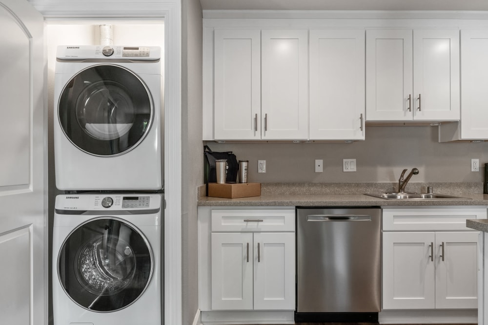 Renovated kitchen with a space for a washer and dryer at Vista Creek in Castro Valley, California.