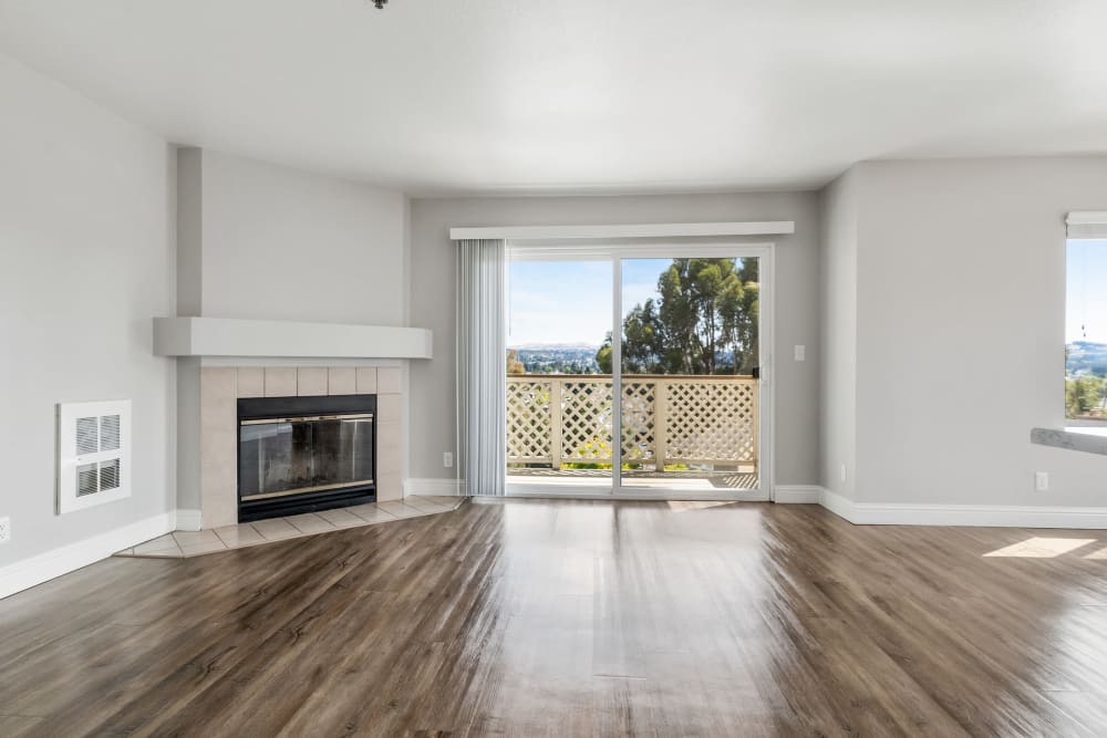 Fireplace and balcony at Quail Hill Apartment Homes in Castro Valley, California