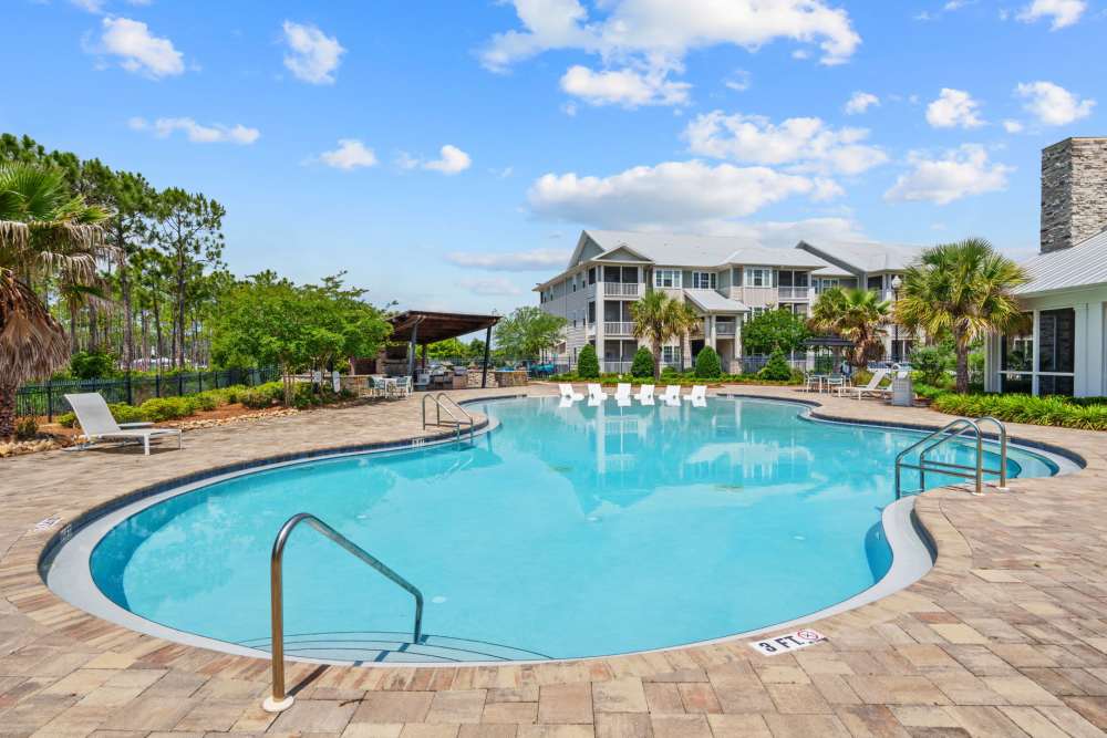 Swimming pool with lounge chairs at Pier Park Crossings in Panama City Beach, Florida