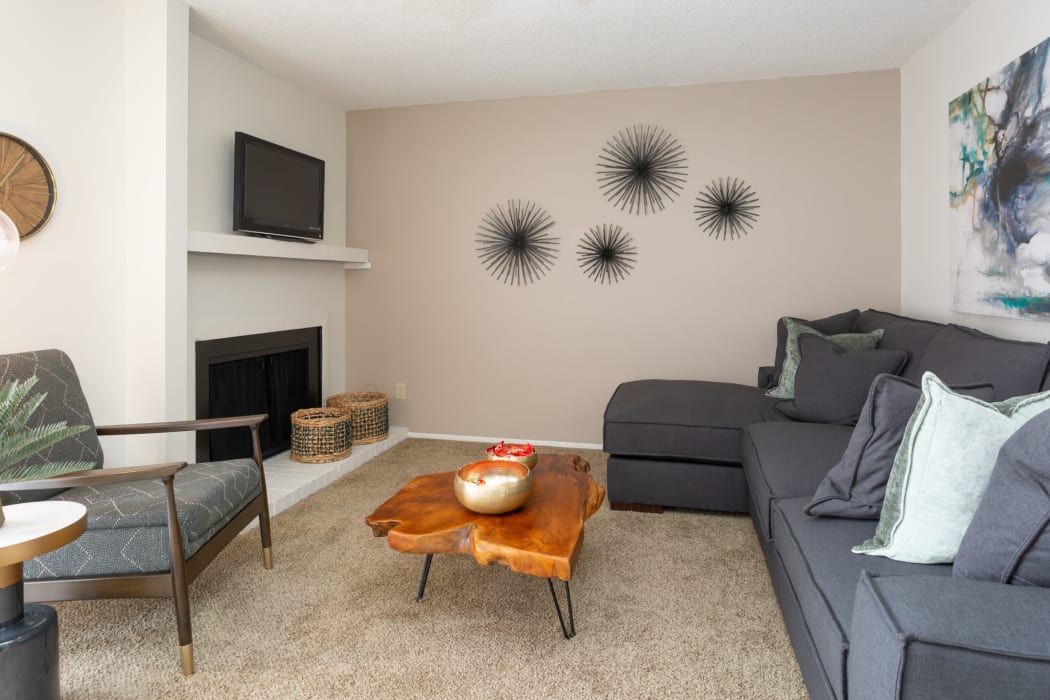 Living room with fireplace at Mountain Village in El Paso, Texas