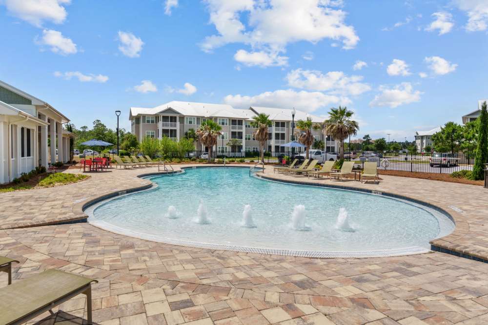 Sparkling swimming pool in front of an apartment building at Pier Park Crossings in Panama City Beach, Florida