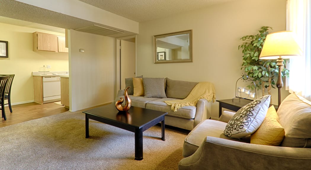 Spacious living area in model home at Creekside Village Apartment Homes in San Bernardino, CA