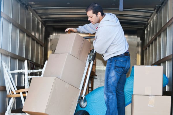 A man using a dolly at Baton Rouge Self Storage