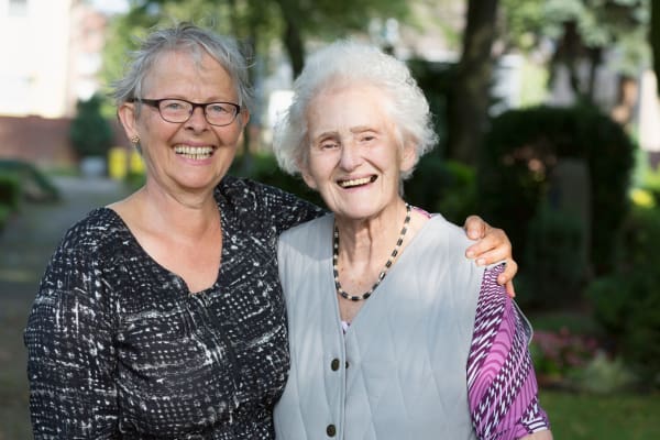 Ladies smiling outside at Ramsey Village Continuing Care in Des Moines, Iowa