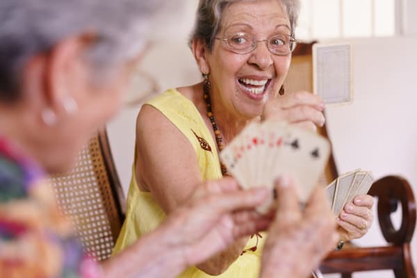 Oakleaf Senior Living residents engaging in a fun game of cards.