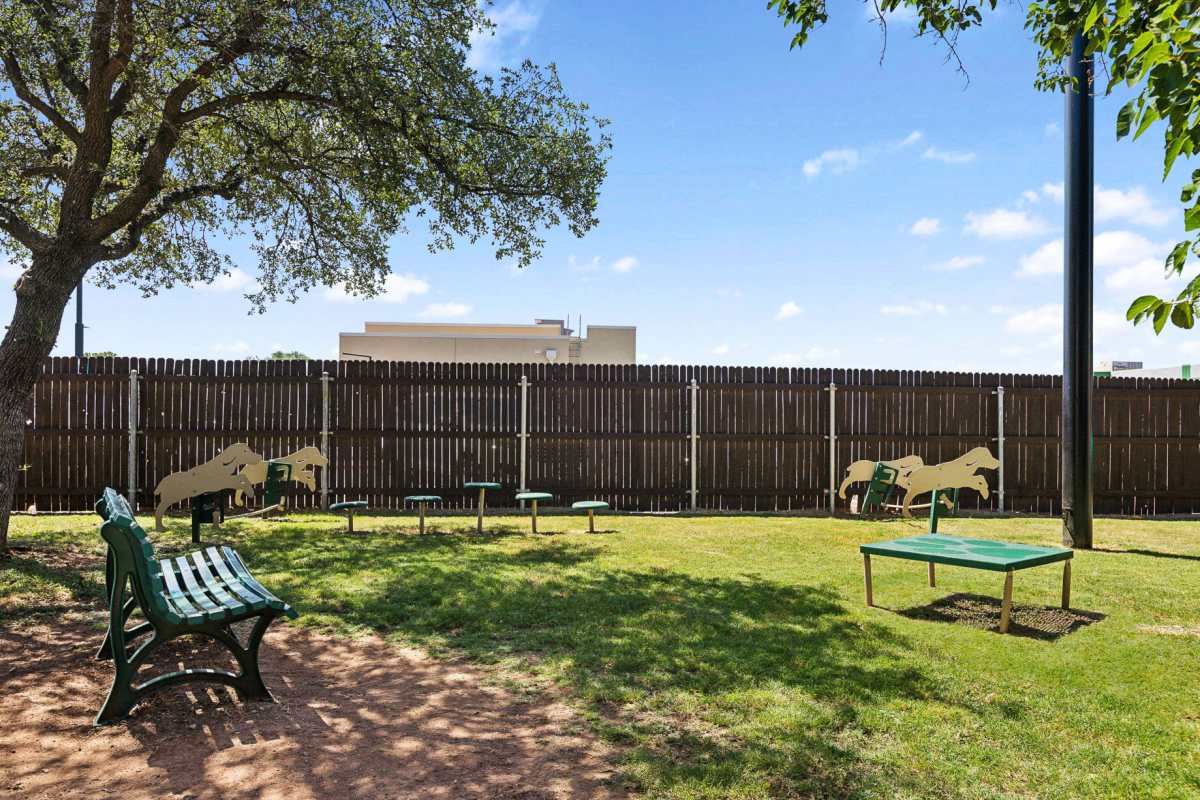 Gated pet park with seating at Creekside in San Angelo, Texas