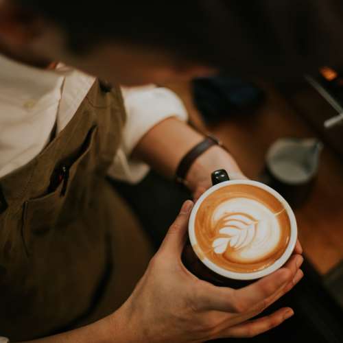 Latte at a cafe near 1801L Apartments in Sacramento, California