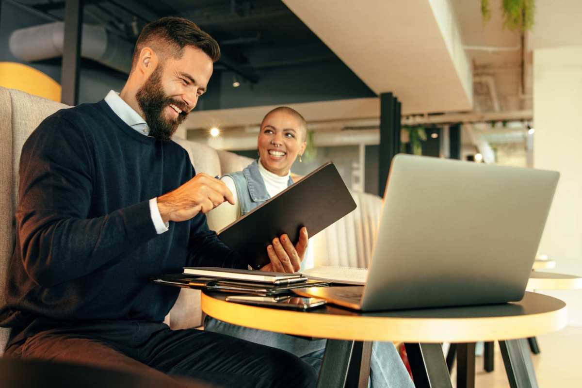 Residents discussing in the business center at Flats at Stone Hogan in Atlanta, Georgia