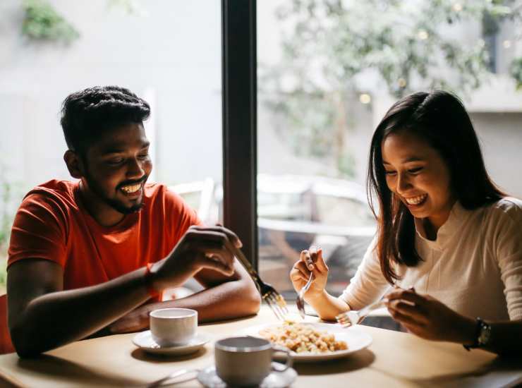 A couple out for coffee and breakfast in the neighborhood near Avalon in Davis, California