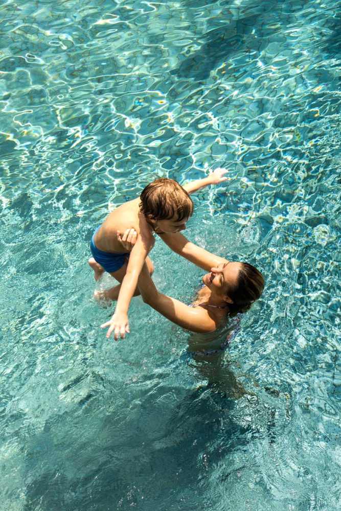 Happy mother and child in the community pool at Icon Apartments in San Antonio,Texas