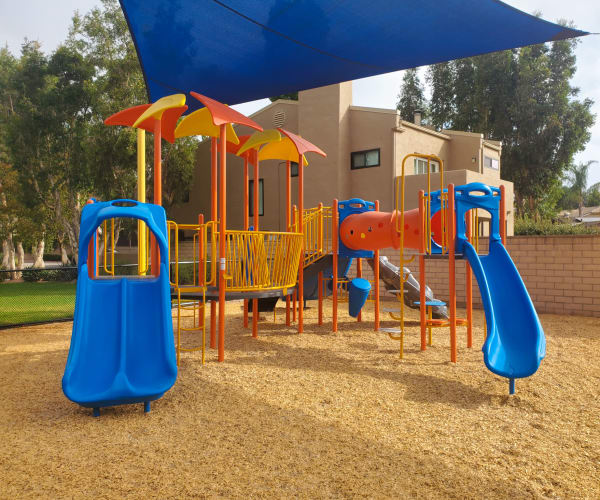 Playground equipment under shade cover at Hilleary Park in San Diego, California