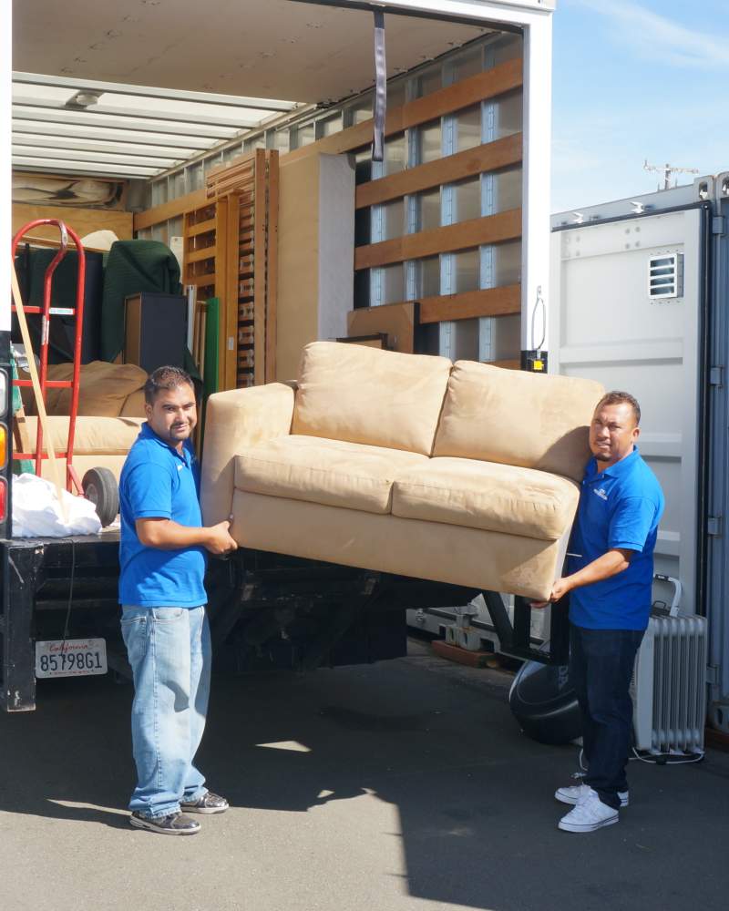 Two men loading a truck at CSI Mini Storage in Richmond, California