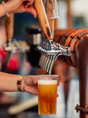 A drink being poured at a brewery near Harborside Marina Bay Apartments in Marina del Rey, California