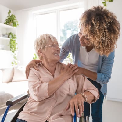 A staff member talking to a resident at Ebenezer Ridges Campus in Burnsville, Minnesota