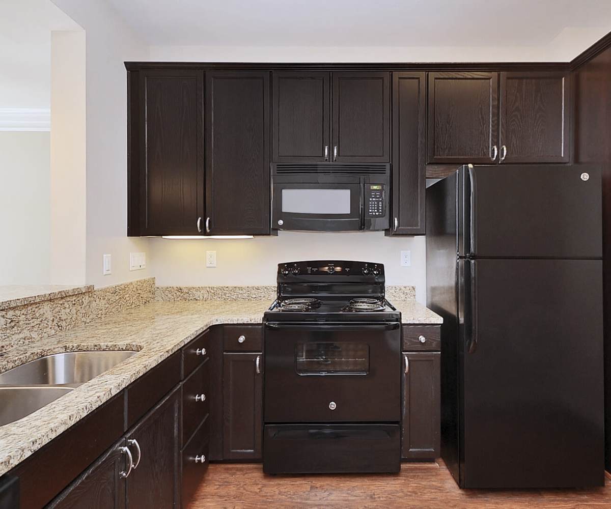 Kitchen with black appliances at Marshall Springs at Gayton West in Glen Allen, Virginia  
