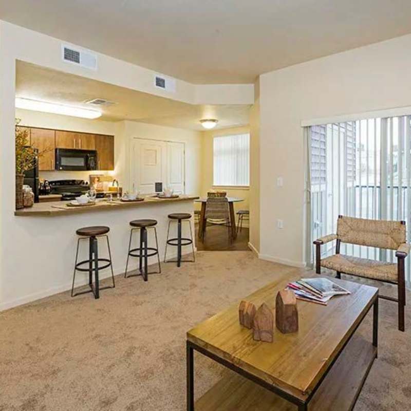 Spacious living room with access to private balcony at Copper Mountain in Richland, Washington