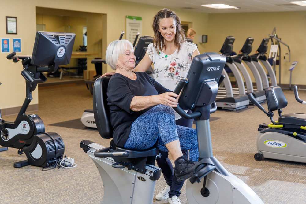 Resident with personal trainer at Touchmark at Meadow Lake Village in Meridian, Idaho