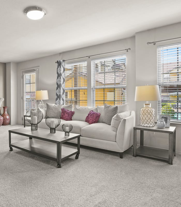 Carpeted living room at Mission Point Apartments in Moore, Oklahoma