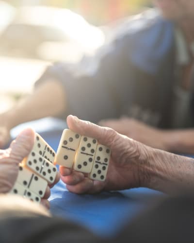 People playing dominos at Kenmore Senior Living in Kenmore, Washington
