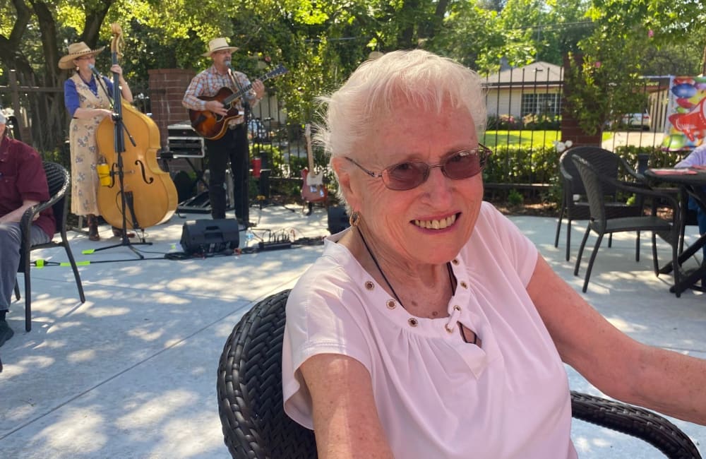 Enjoying live music on the terrace at Roseville Commons Senior Living in Roseville, California