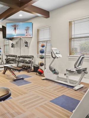 Fitness center at Cottages at Tallgrass Point Apartments in Owasso, Oklahoma
