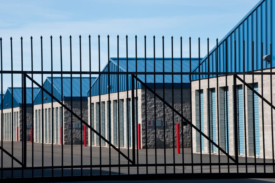 Storage units behind a black metal gate at Centennial Storage in Bonney Lake, Washington