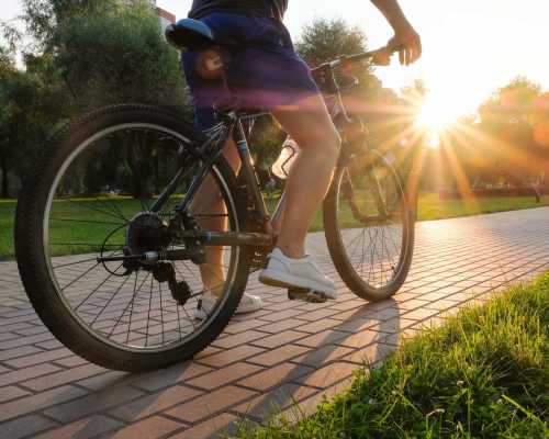 Person cycling in the city near The Hardison in Salt Lake City, Utah