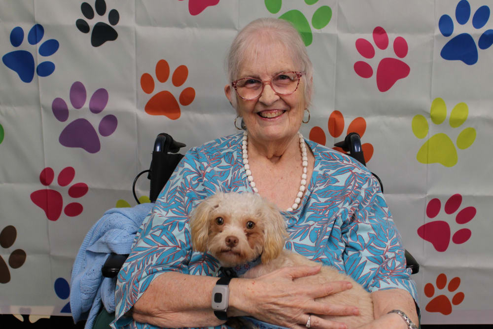 Resident and her dog at Campus Commons Senior Living in Sacramento, California