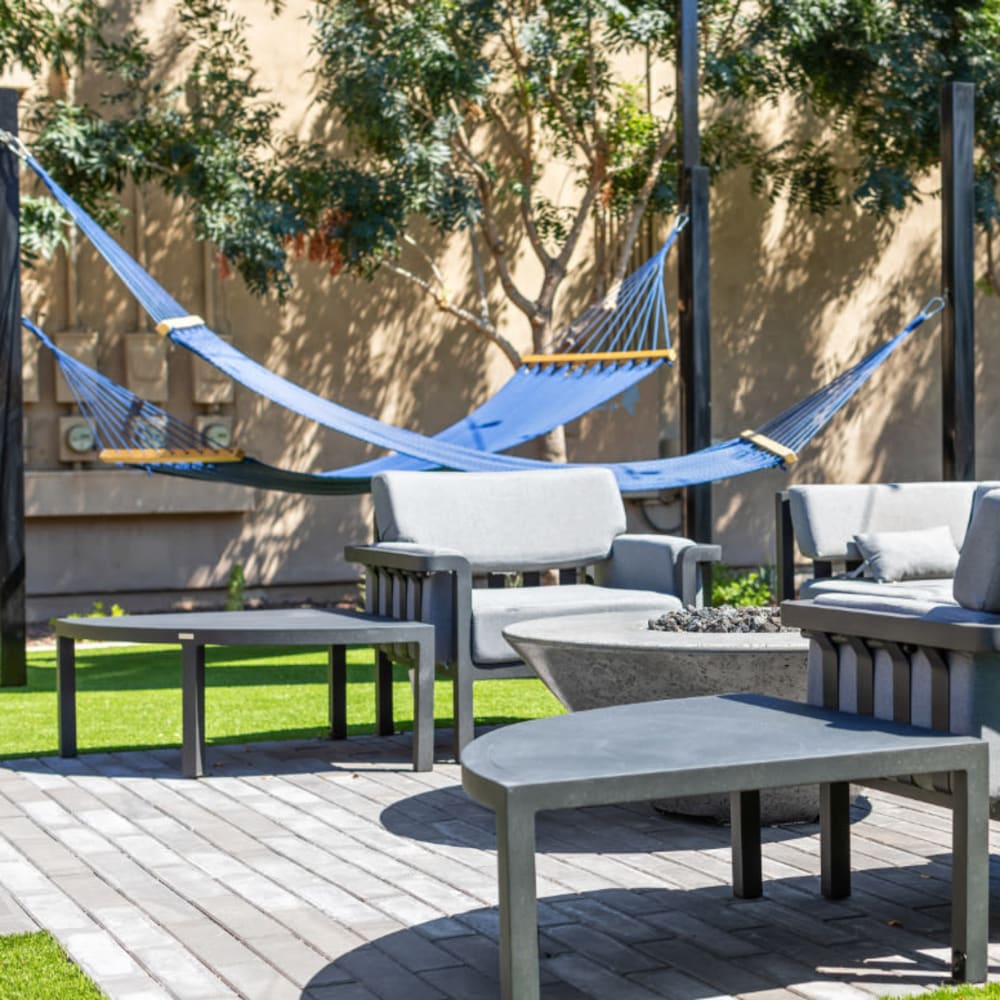 An outdoor patio with hammocks at 1408 Casitas at Palm Valley in Avondale, Arizona