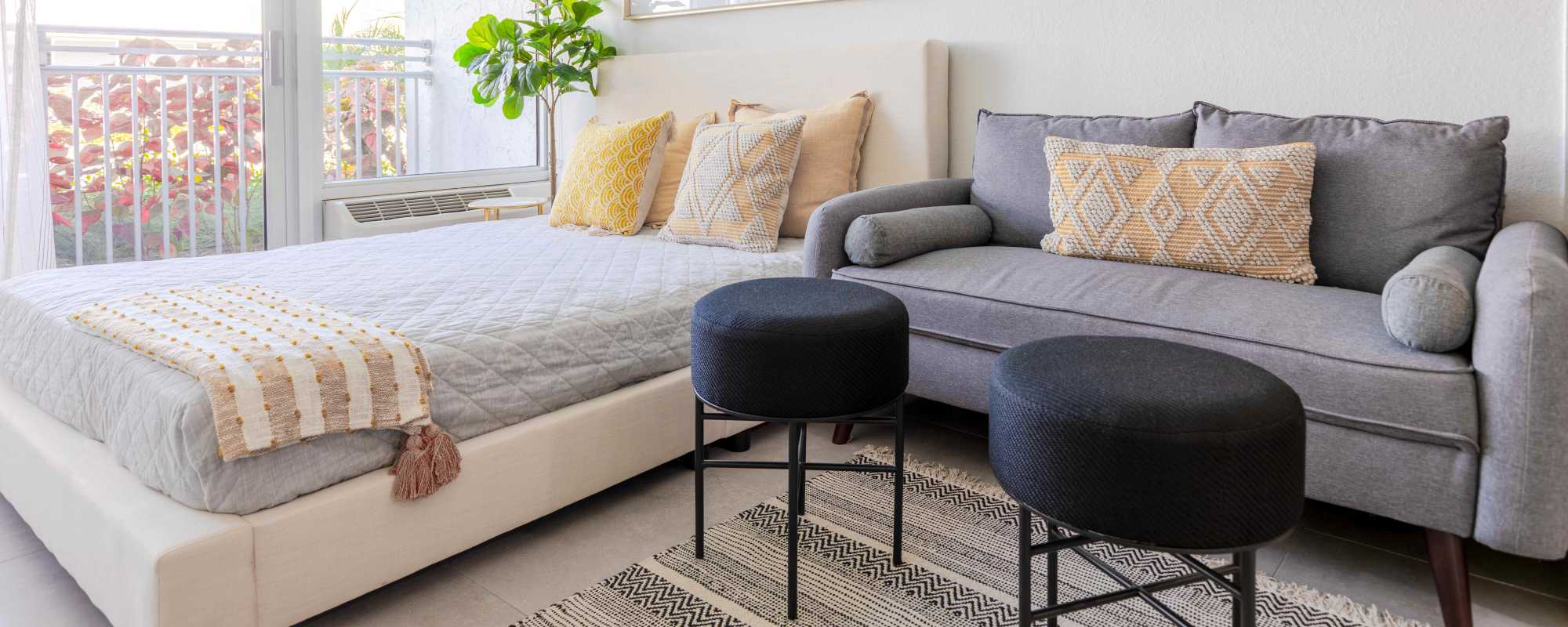 Bedroom with large windows for sunlight at  Alture Westland in Hialeah, Florida
