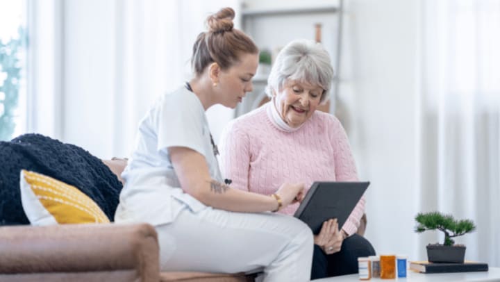 Home Care assistance helping with medications for senior client