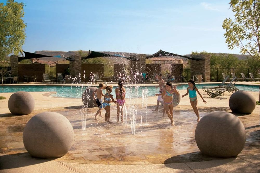 Children playing on the splash pad at BB Living at Vistancia in Peoria, Arizona