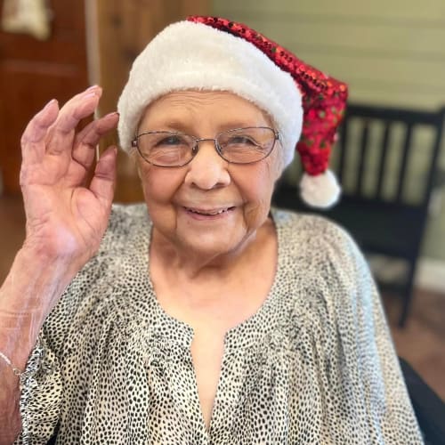 A resident smiling at Oxford Glen Memory Care at Owasso in Owasso, Oklahoma