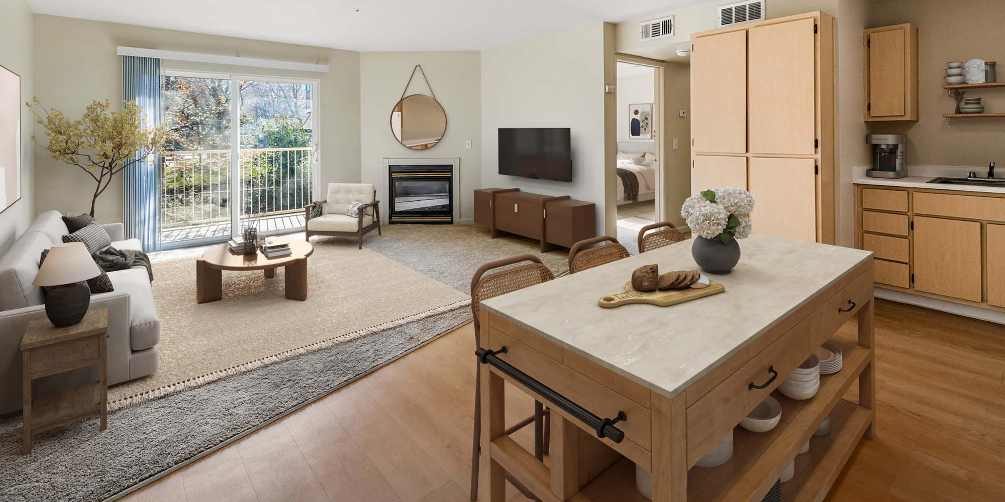 Furnished living room and kitchen at Creekside Village Senior Apartment Homes in Pittsburg, California