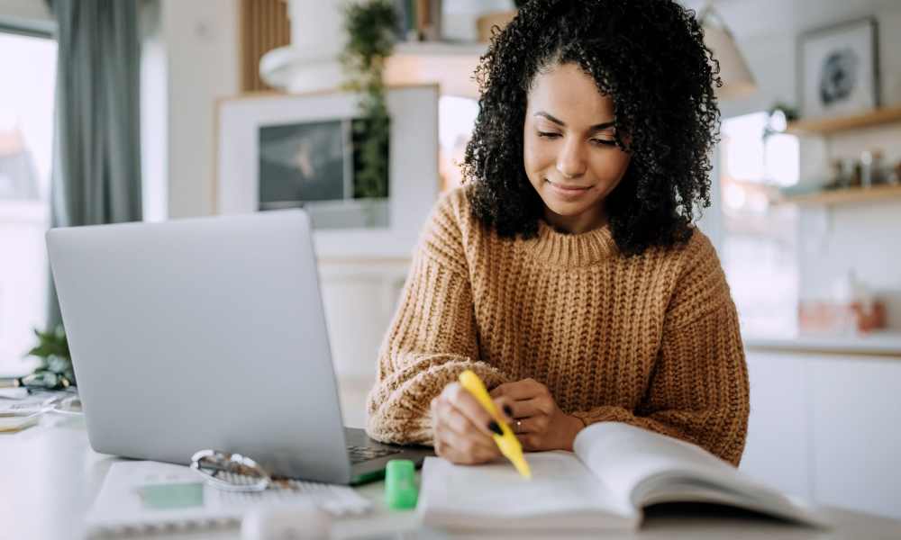 Student in her living room at Malibu in Tucson, Arizona
