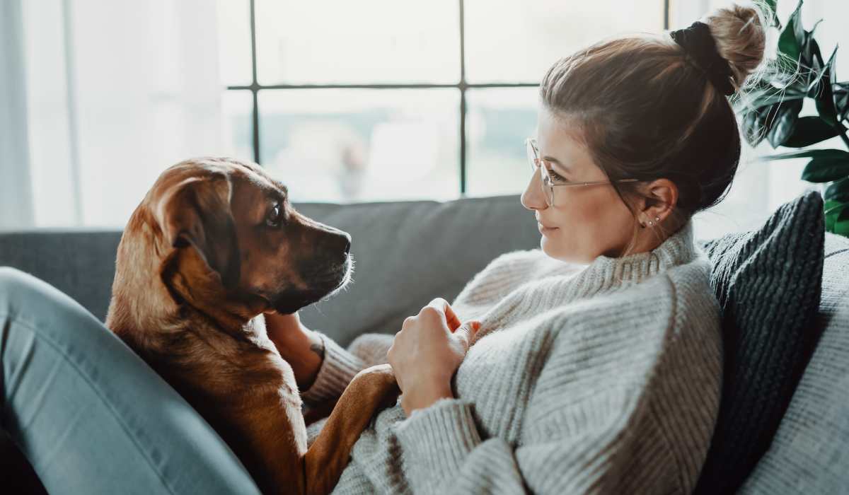 A resident with her puppy at The Amber at Greenbrier, Chesapeake, Virginia