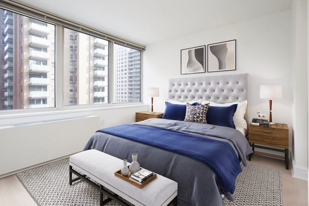 Cozy bedroom with large windows and an amazing view of the city at The Ventura in New York, New York