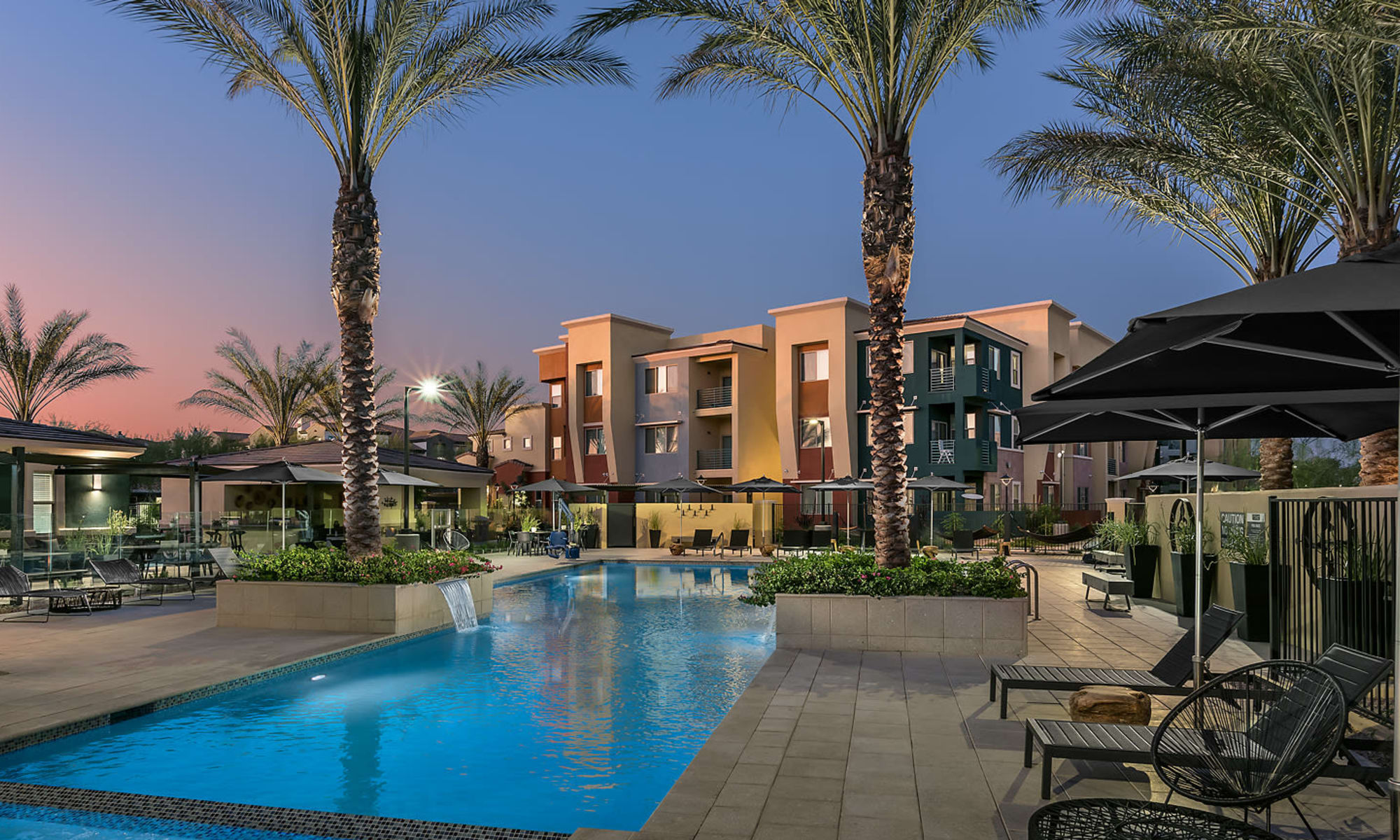 Apartments with a resort style community swimming pool at Villa Vita Apartments in Peoria, Arizona