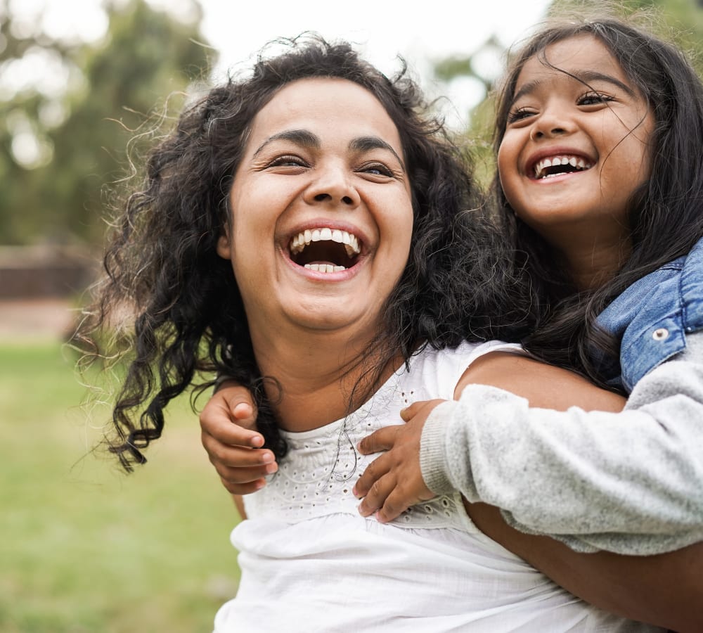 A smiling mother and daughter in a park near Brighton Park in Byron, Georgia