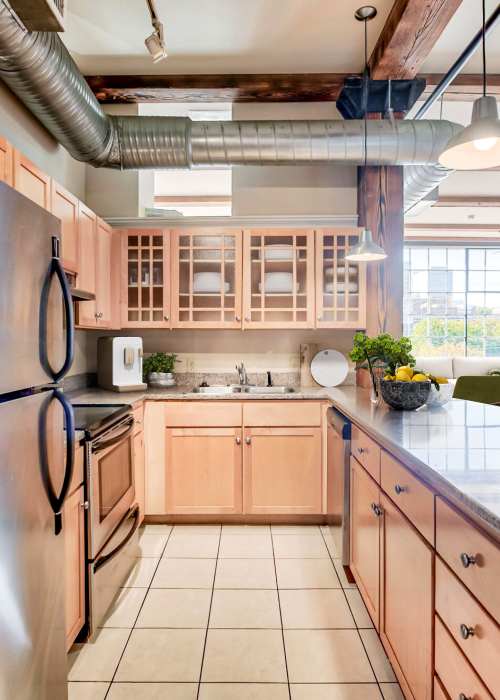 Stainless-steel appliances in an apartment kitchen at Cigar Lofts in Richmond, Virginia