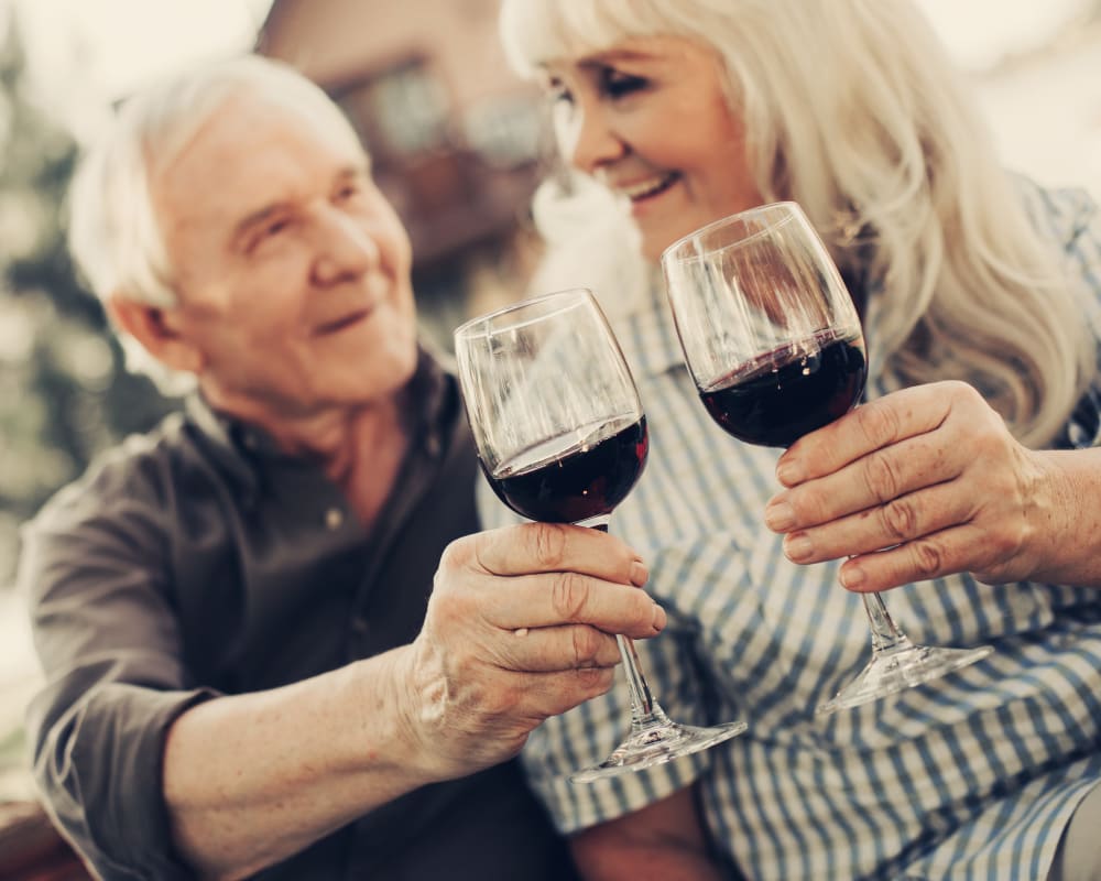 Resident enjoying some wine at WellQuest of Granite Bay in Granite Bay, California