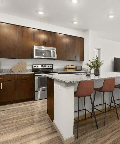 Kitchen with island at Kent Place Residences in Englewood, Colorado