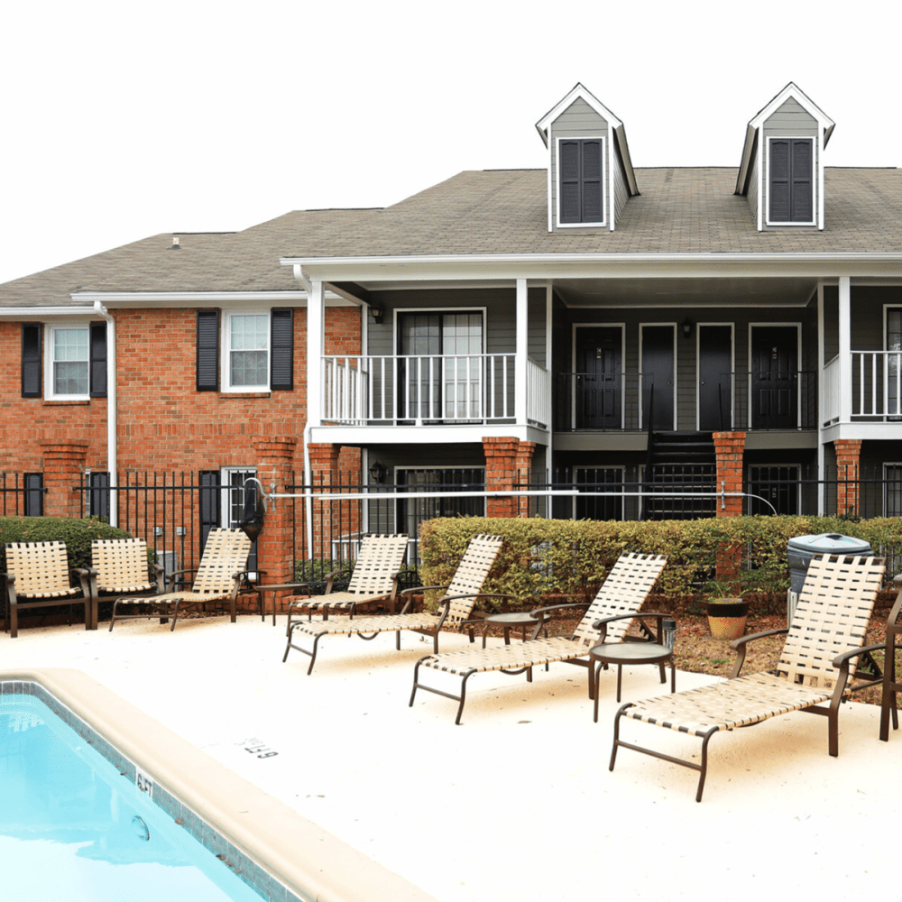 Swimming pool with laid back chairs at Tapestry on Vaughn in Montgomery, Alabama
