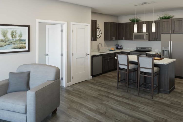 Woman walking on wood floor in an Attivo Trail apartment