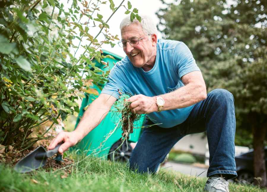 Resident watering plants at Hilltop Senior in Irvington, New Jersey