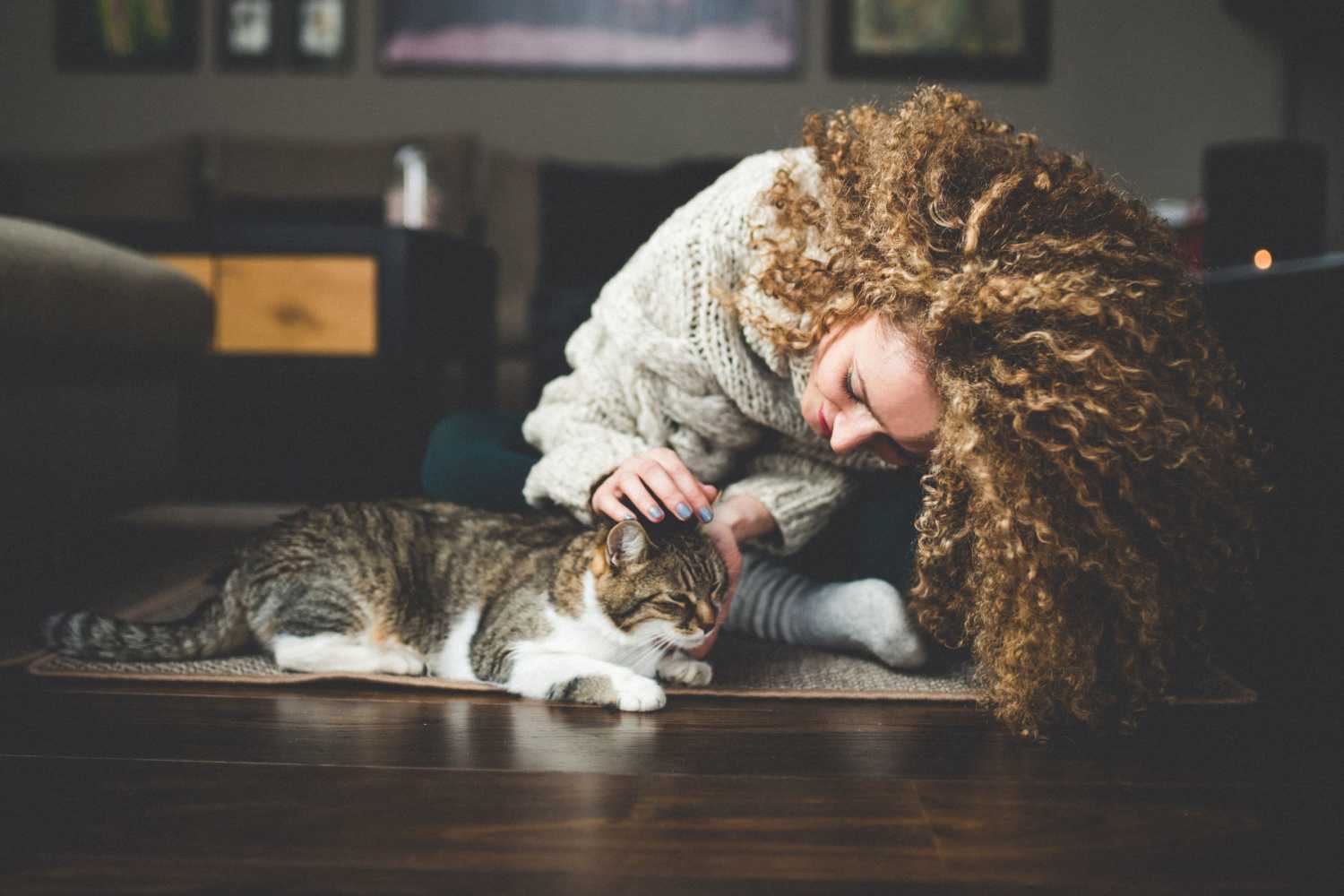 Resident petting her cat in their new home at Patriots Place in Valdosta, Georgia