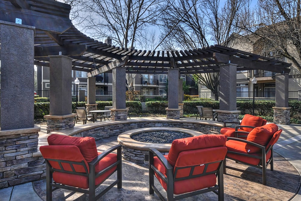 A clubhouse patio next to a large firepit at Larkspur Woods in Sacramento, California