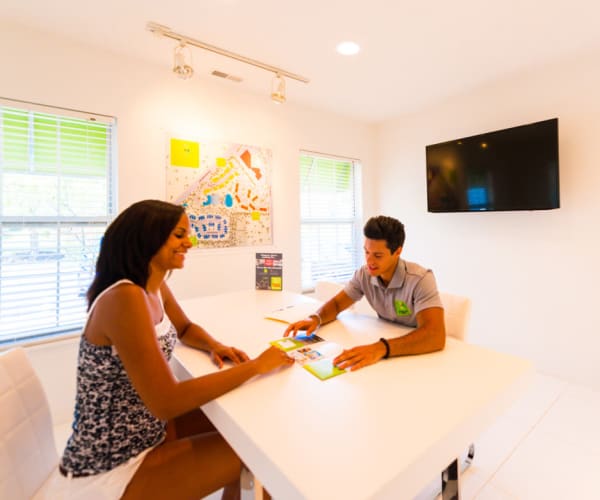 Friendly team member talking to a potential resident at Campus Life & Style in Austin, Texas